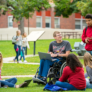 Students lounging on the front lawn