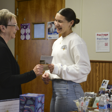 Campus nurse Betty Tykwinski helping a student